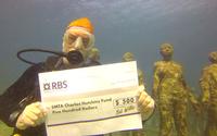 Recent SMTA International Best of Conference Award Winner, Bob Willis pledges half of his award to the Charles Hutchins Educational Grant while on a scuba trip